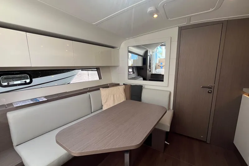 Slide: The Image of Interior of 2026 Beneteau Gran Turismo 41 yacht, featuring modern dining area and sleek design. - 31