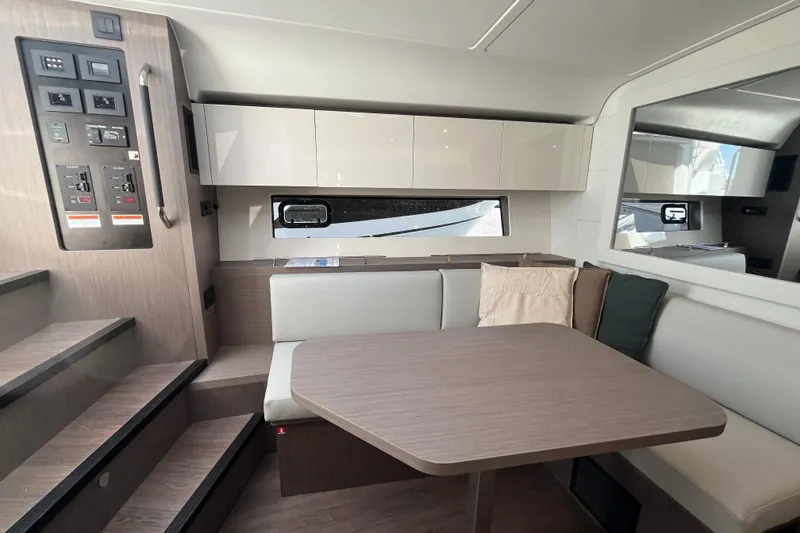 Slide: The Image of Interior of 2026 Beneteau Gran Turismo 41 yacht with modern seating and cabinetry. - 32