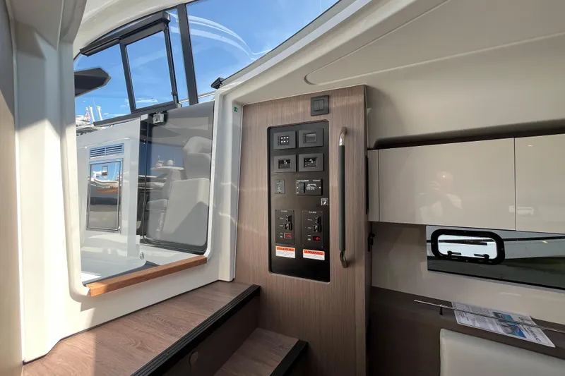 Slide: The Image of Interior view of 2026 Beneteau Gran Turismo 41 yacht, featuring control panel and modern design. - 33