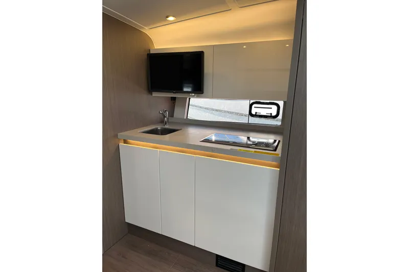 Slide: The Image of Modern kitchen area in 2026 Beneteau Gran Turismo 41 yacht with sleek cabinetry and appliances. - 34
