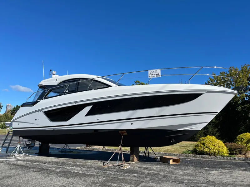 Slide: The Image of 2025 Beneteau Gran Turismo 41 yacht on display under clear blue sky. - 7