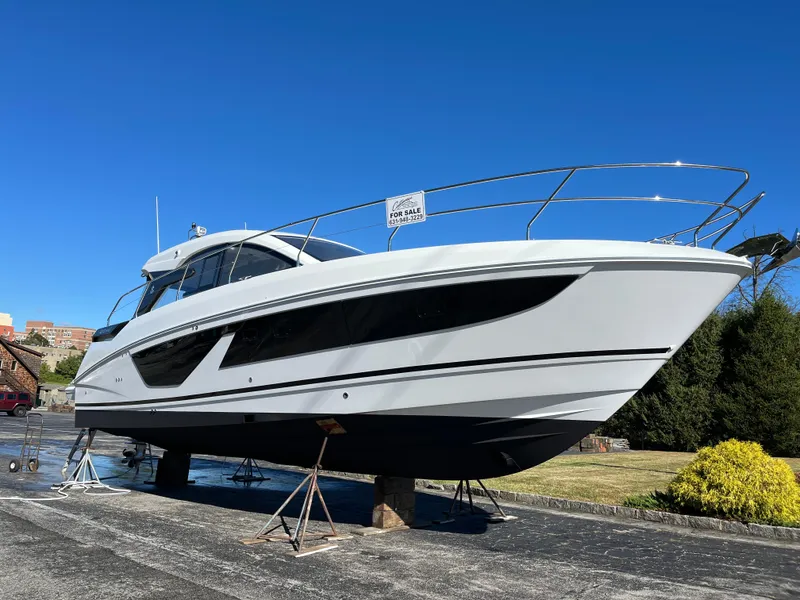 Slide: The Image of 2025 Beneteau Gran Turismo 41 yacht on display under clear blue sky. - 8