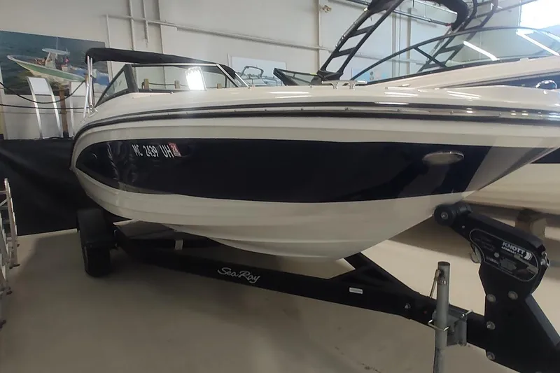Slide: The Image of 2018 Sea Ray SPX 190 boat on trailer in showroom. - 1