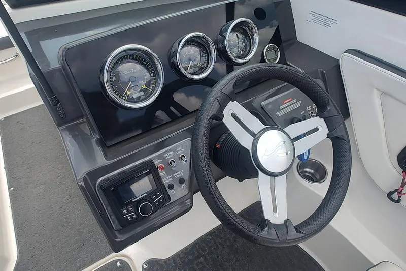Slide: The Image of Steering console of 2018 Sea Ray SPX 190 boat with gauges and controls. - 13