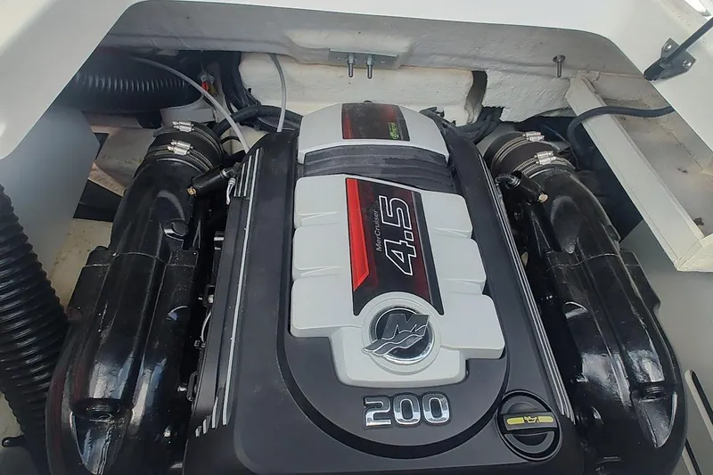 Slide: The Image of Engine compartment of a 2018 Sea Ray SPX 190 boat, featuring a MerCruiser 4.5 engine. - 14