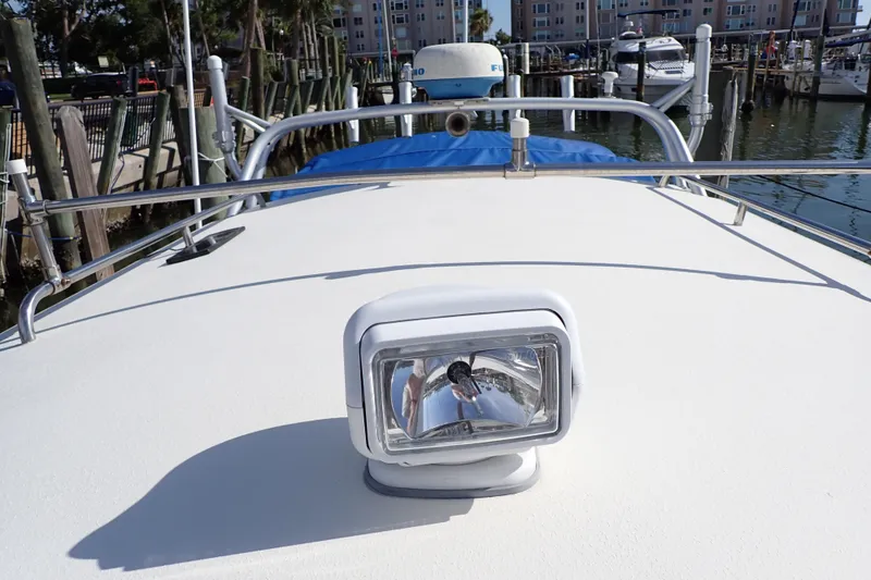 Slide: The Image of 2000 Albin 28 Tournament Express boat deck with spotlight, docked in marina. - 21