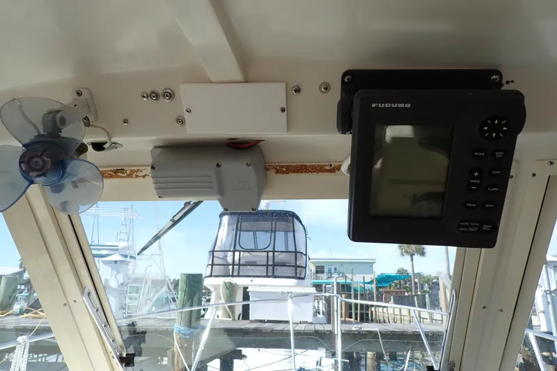 Slide: The Image of Interior of 2000 Albin 28 Tournament Express with navigation equipment and fan. - 23