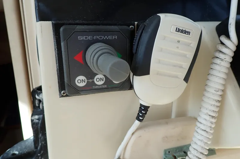 Slide: The Image of Control panel and microphone on a 2000 Albin 28 Tournament Express boat. - 31