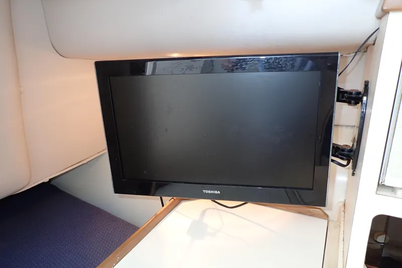 Slide: The Image of Toshiba TV mounted inside 2000 Albin 28 Tournament Express boat cabin. - 43
