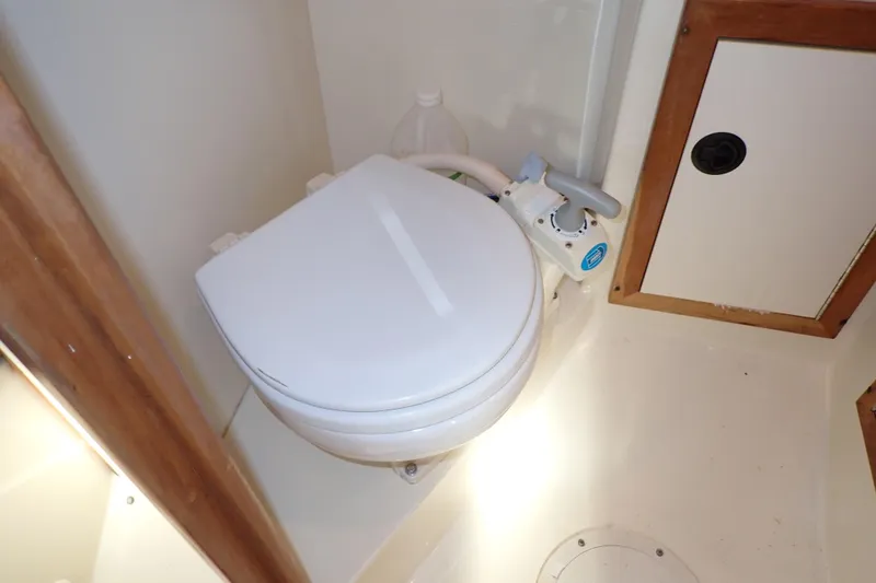Slide: The Image of Boat bathroom with toilet in 2000 Albin 28 Tournament Express. - 49
