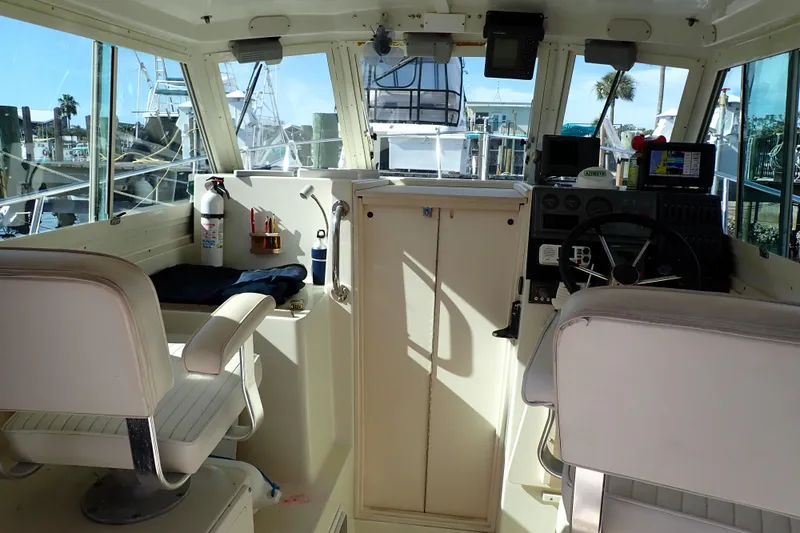 Slide: The Image of Interior of 2000 Albin 28 Tournament Express boat with helm and seating. - 5