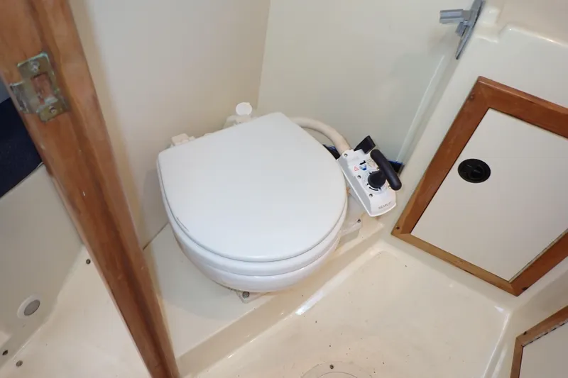 Slide: The Image of Boat bathroom with toilet in 2000 Albin 28 Tournament Express. - 53