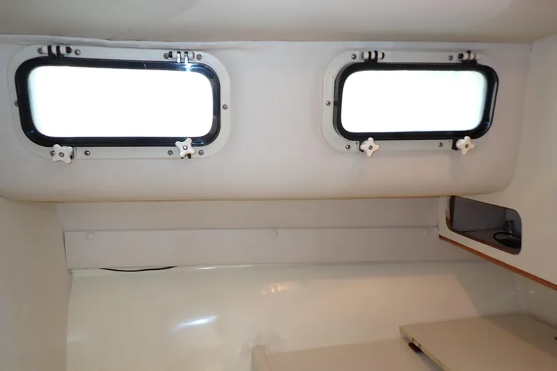Slide: The Image of Interior cabin of 2000 Albin 28 Tournament Express with two portholes. - 54