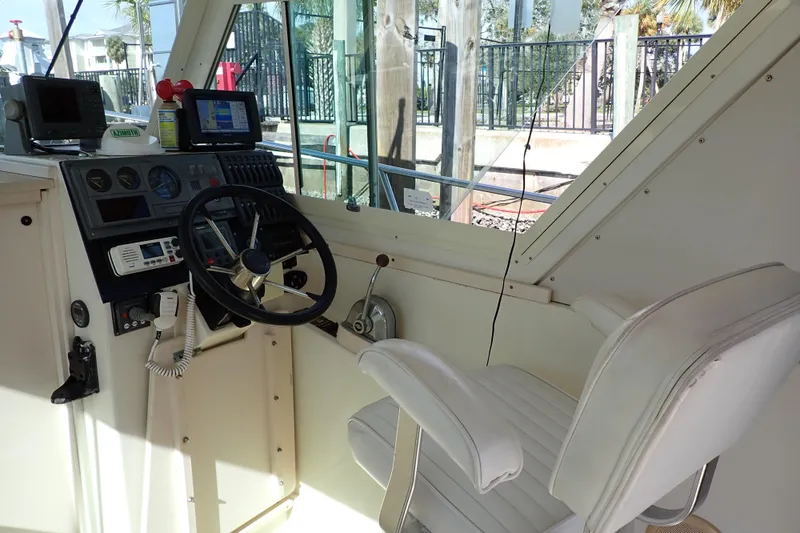 Slide: The Image of Interior helm of 2000 Albin 28 Tournament Express with steering wheel and navigation equipment. - 6