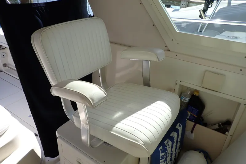 Slide: The Image of Captain's chair inside a 2000 Albin 28 Tournament Express boat cabin. - 9