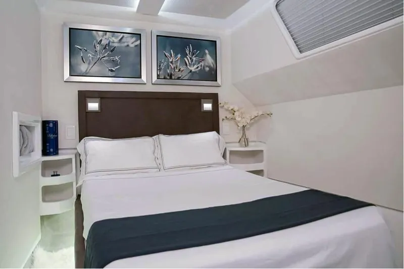 Slide: The Image of Luxurious bedroom in 2024 Leeuwin 55 yacht with modern decor and elegant bedding. - 14