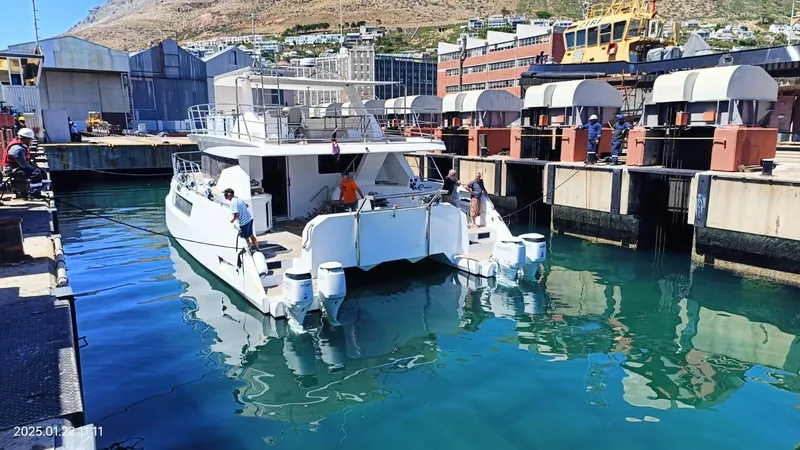 Slide: The Image of 2024 Leeuwin 55 yacht docked at a marina with crew onboard. - 29