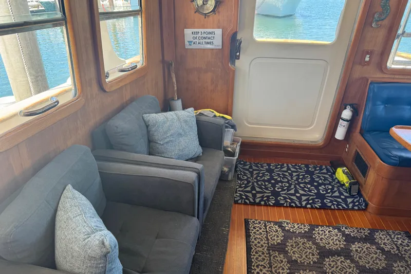 Slide: The Image of Interior of a 1995 Nordhavn 46 yacht with cozy seating and nautical decor. - 17