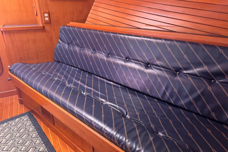 Slide: The Image of Interior seating of a 1995 Nordhavn 46 yacht with blue patterned upholstery. - 22