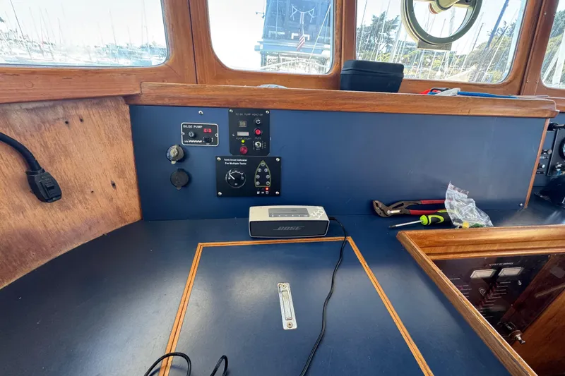 Slide: The Image of Control panel of a 1995 Nordhavn 46 yacht with tools and speaker. - 27