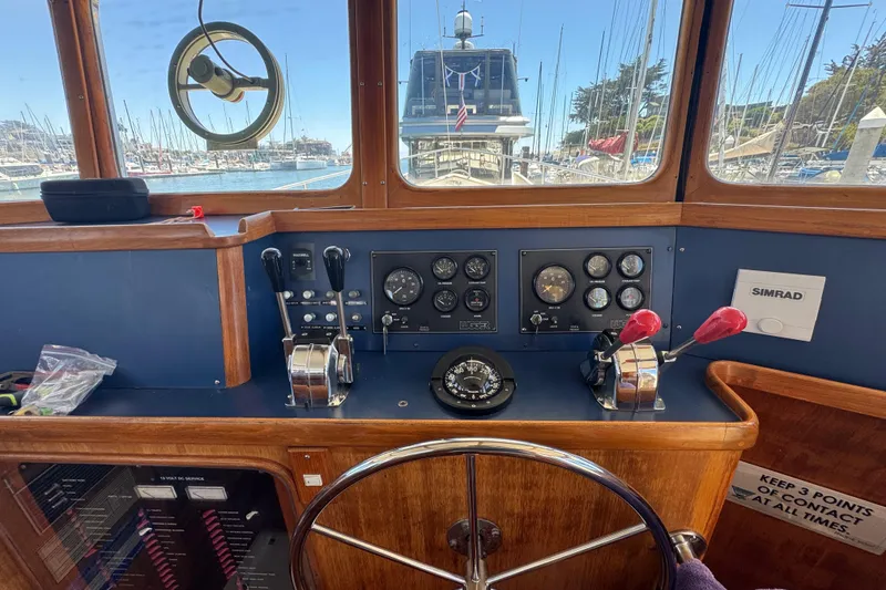 Slide: The Image of Helm of 1995 Nordhavn 46 yacht with navigation instruments and controls. - 28