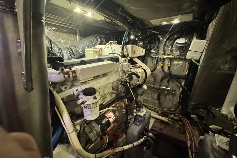 Slide: The Image of Engine room of a 1995 Nordhavn 46 yacht, showcasing mechanical components and wiring. - 35