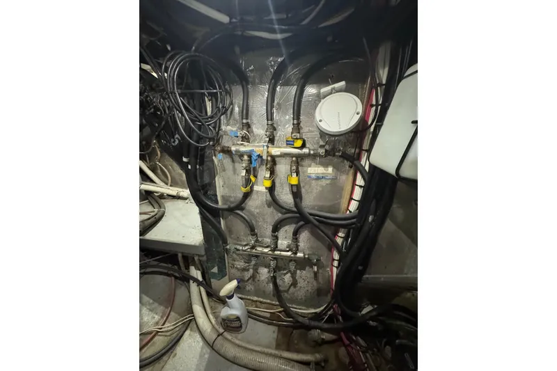 Slide: The Image of Engine room wiring and plumbing of a 1995 Nordhavn 46 yacht. - 42