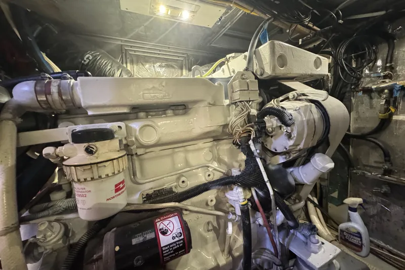 Slide: The Image of Engine room of a 1995 Nordhavn 46 yacht, showcasing detailed machinery components. - 44