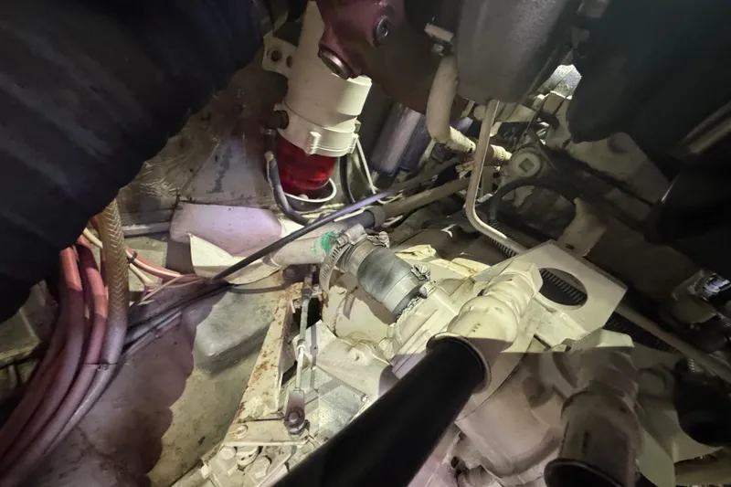 Slide: The Image of Engine room of a 1995 Nordhavn 46 yacht, showcasing mechanical components and wiring. - 46