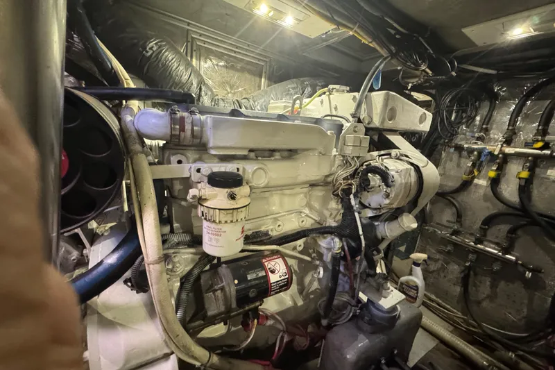 Slide: The Image of Engine room of a 1995 Nordhavn 46 yacht, showcasing detailed machinery and wiring. - 48