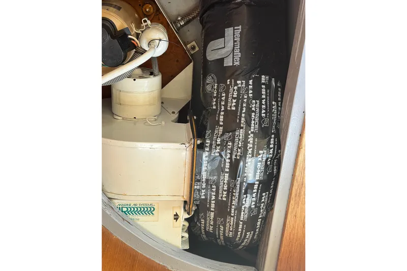 Slide: The Image of Marine air system components inside a 1995 Nordhavn 46 yacht. - 52