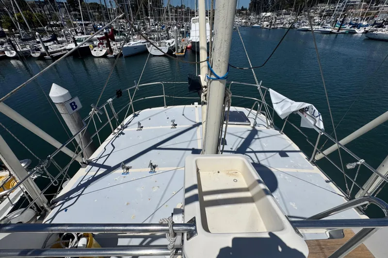Slide: The Image of Deck view of a 1995 Nordhavn 46 yacht docked in a marina. - 6