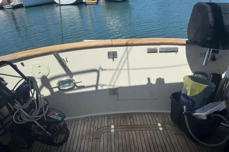 Slide: The Image of Deck of a 1995 Nordhavn 46 yacht with cleaning equipment and ocean view. - 8