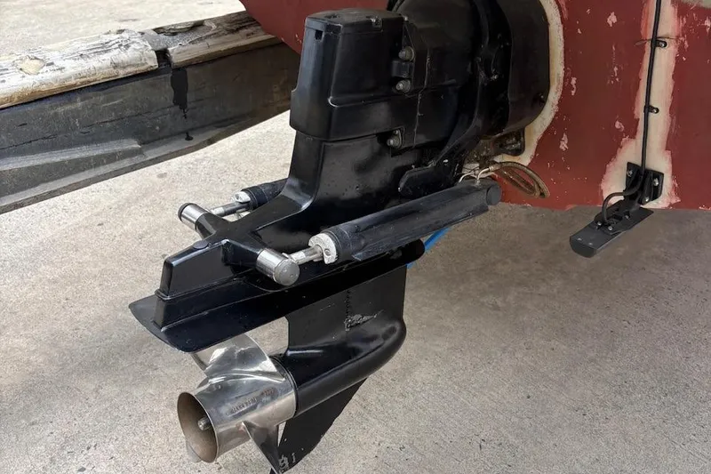 Slide: The Image of Bayliner 210 Classic 2001 boat outboard motor and propeller on trailer. - 4