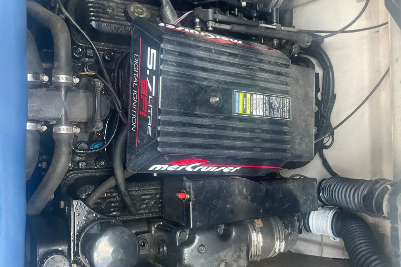 Slide: The Image of Engine compartment of a 1999 Bryant 214 Cuddy with MerCruiser 5.7L EFI engine. - 13