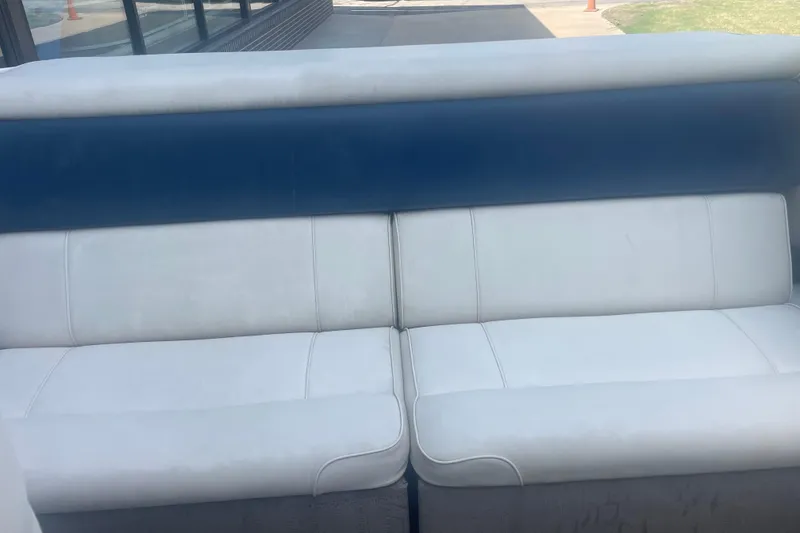 Slide: The Image of White and blue seating on a 1999 Bryant 214 Cuddy boat. - 8