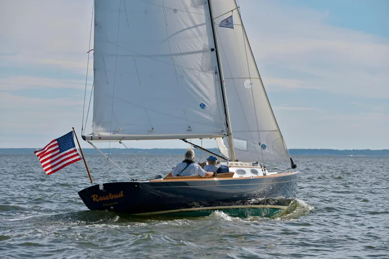 The Image of Sailboat Alerion Express 28 (2004) with American flag on open water. - 0