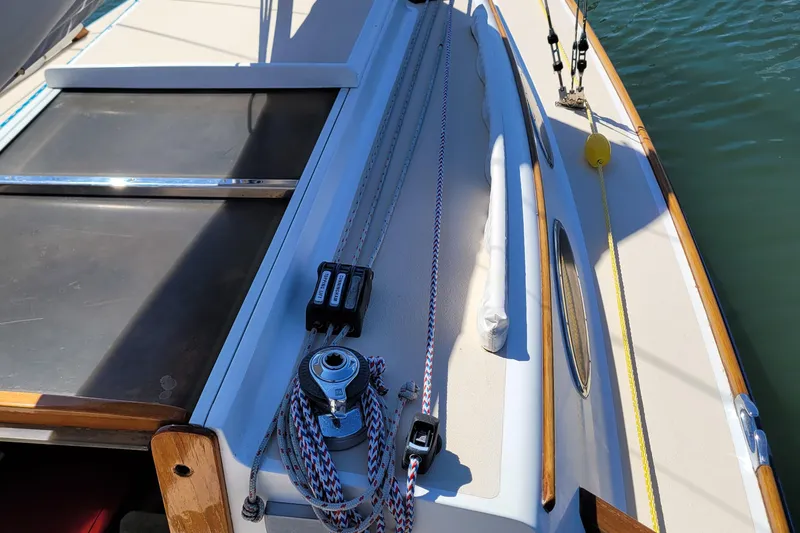 Slide: The Image of 2004 Alerion Express 28 sailboat deck with rigging and hardware details. - 12