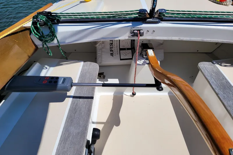 Slide: The Image of Cockpit of 2004 Alerion Express 28 sailboat with wooden tiller and control panel. - 20