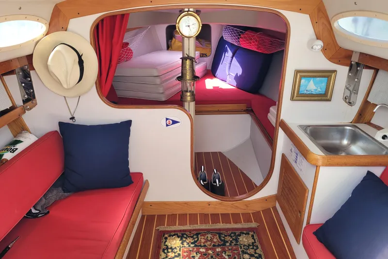 Slide: The Image of Interior of 2004 Alerion Express 28 sailboat with cozy seating and nautical decor. - 24