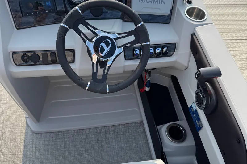 Slide: The Image of 2025 Tahoe Pontoon 25 LSZ Versatile Rear Bench steering console with Garmin display. - 3