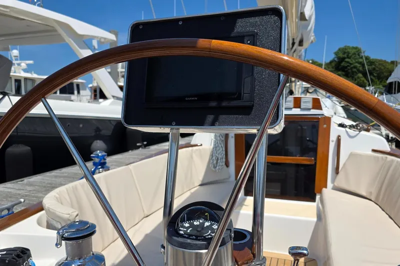 Slide: The Image of Cockpit of 2020 Alerion Express 33 sailboat with wooden wheel and navigation instruments. - 10