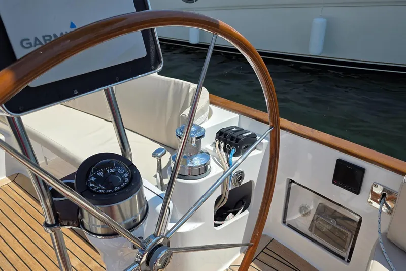 Slide: The Image of Steering wheel and controls of a 2020 Alerion Express 33 sailboat. - 11