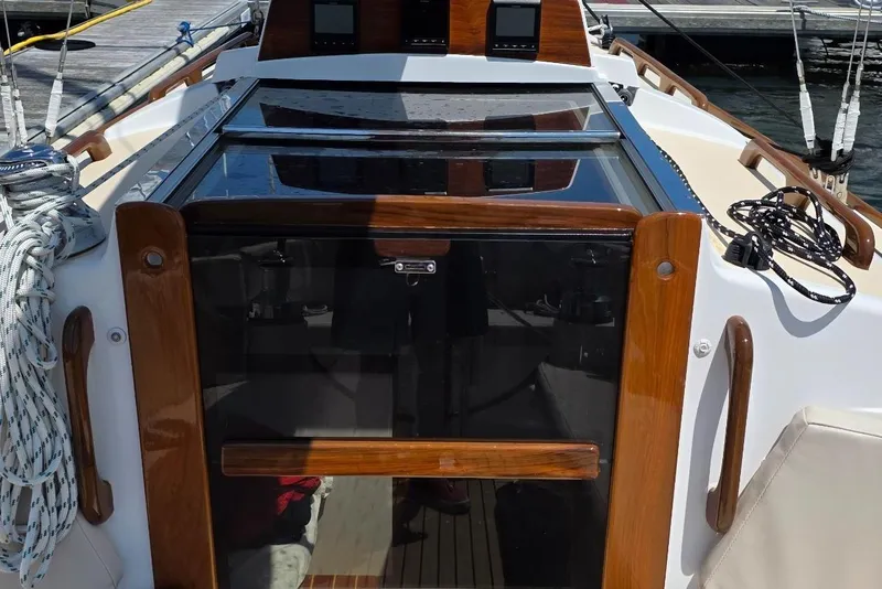 Slide: The Image of Alerion Express 33 sailboat cockpit with polished wood trim, 2020 model. - 14