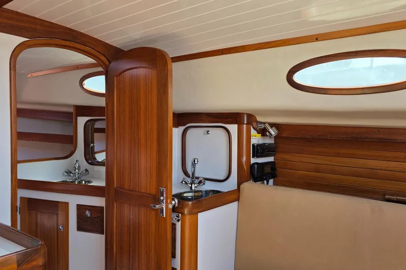 Slide: The Image of Interior of 2020 Alerion Express 33 sailboat with wooden finishes and compact sink. - 20