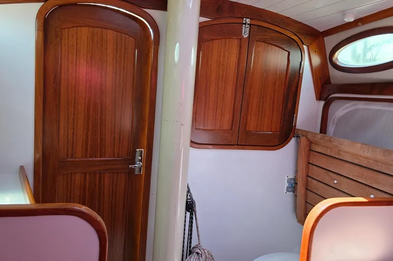 Slide: The Image of Interior of 2020 Alerion Express 33 sailboat with wooden doors and cabinetry. - 27