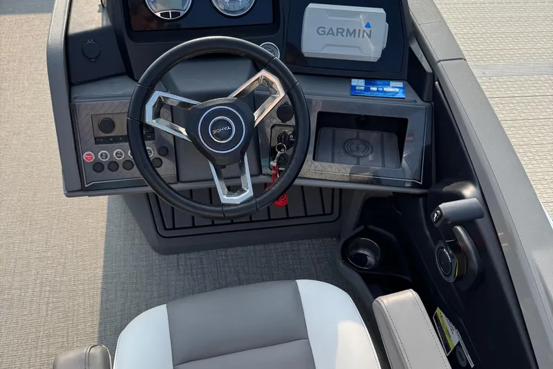 Slide: The Image of 2025 Tahoe Pontoon 23 LSZ Quad Bench dashboard with Garmin navigation system. - 4