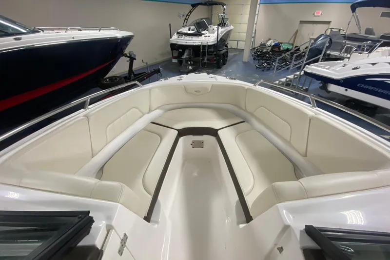 Slide: The Image of 2020 Chaparral 237 SSX boat interior with spacious seating in showroom. - 3