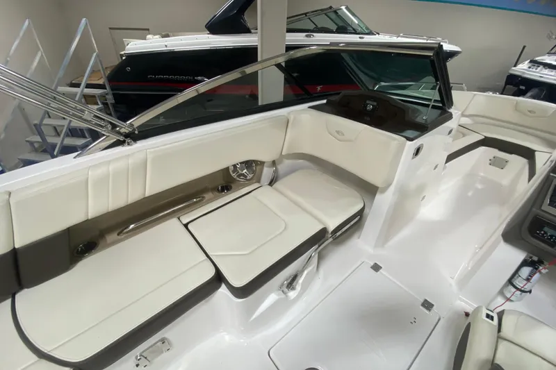 Slide: The Image of 2020 Chaparral 237 SSX boat interior with white seating and sleek design. - 5