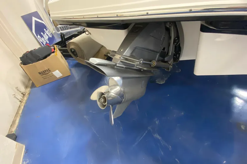 Slide: The Image of 2020 Chaparral 237 SSX boat propeller and stern drive on blue floor. - 9